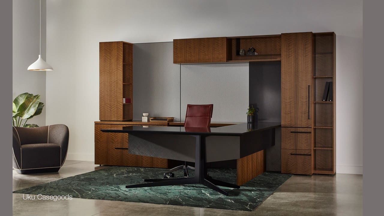 A desk with a chair and some cabinets