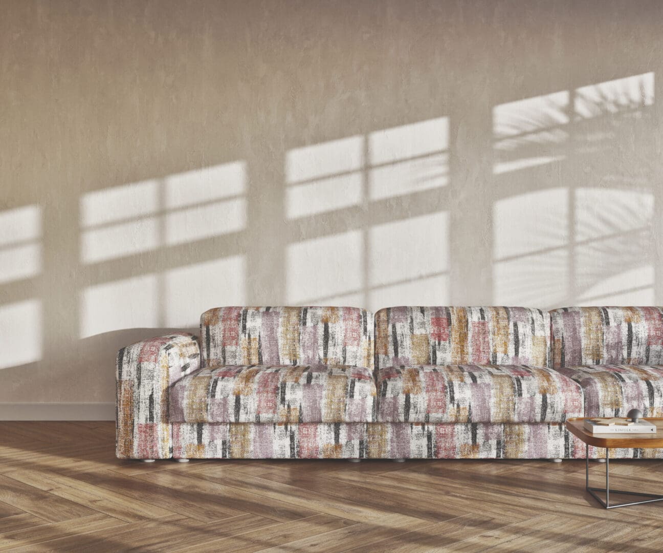 A couch in front of some windows with blinds on them