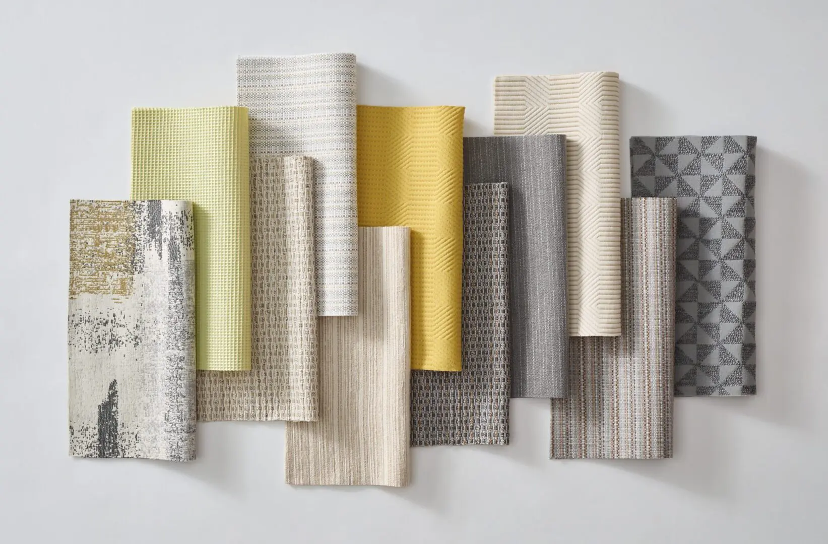 A bunch of different types of fabric on display